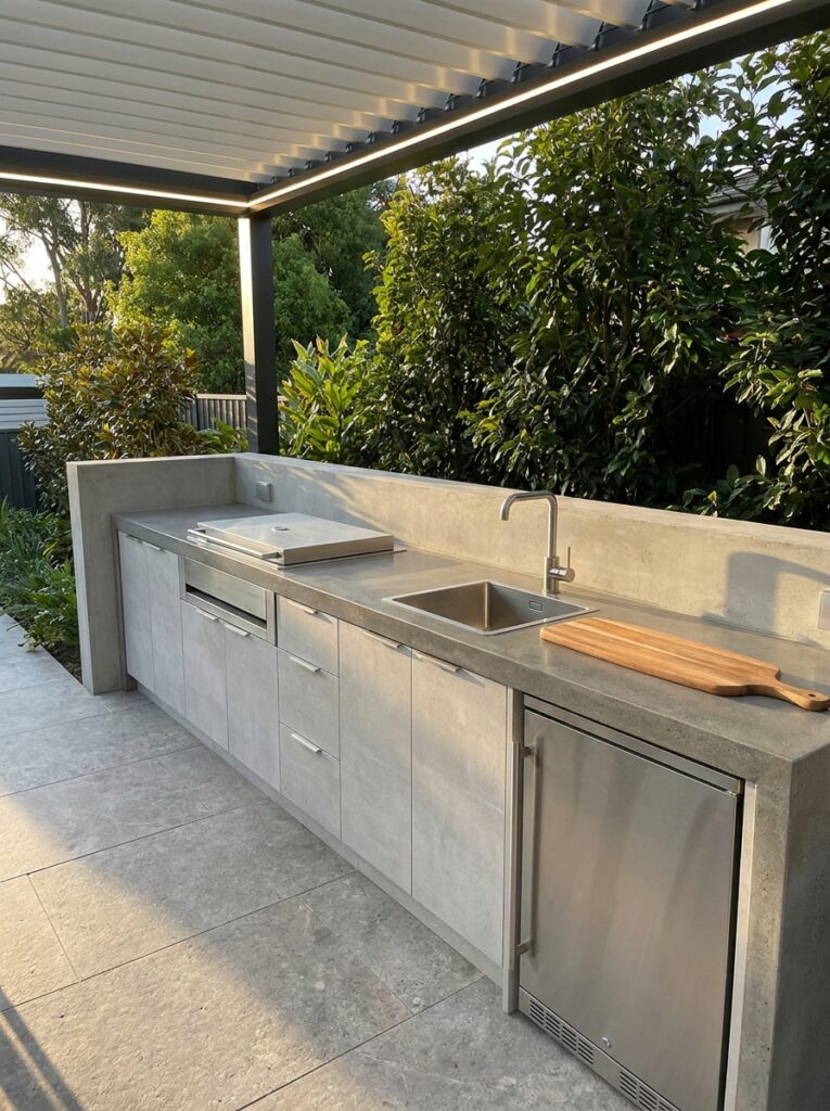 Easy to clean outdoor kitchen design with smooth surfaces and simple layout